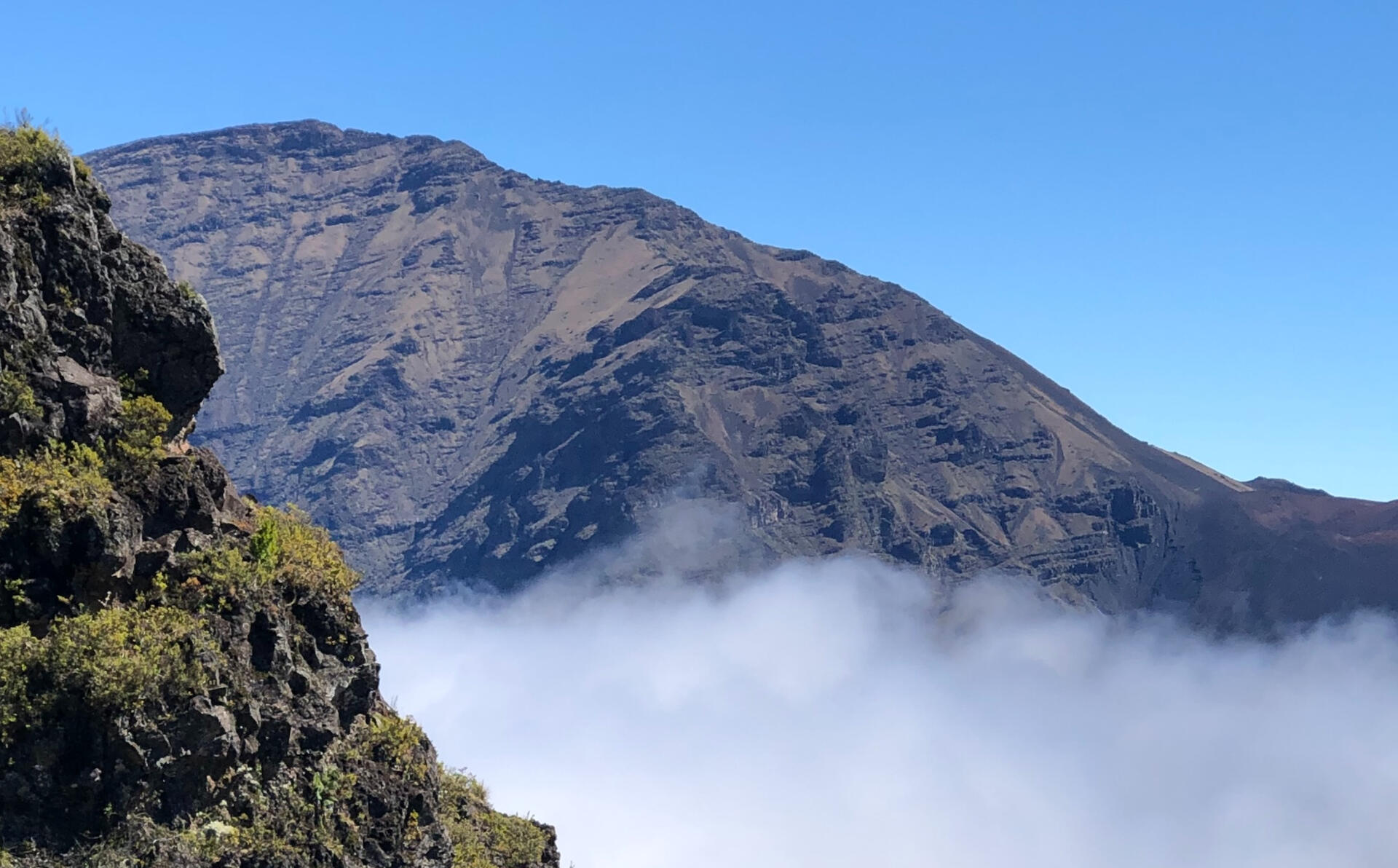 Family hiking above the clouds on Maui